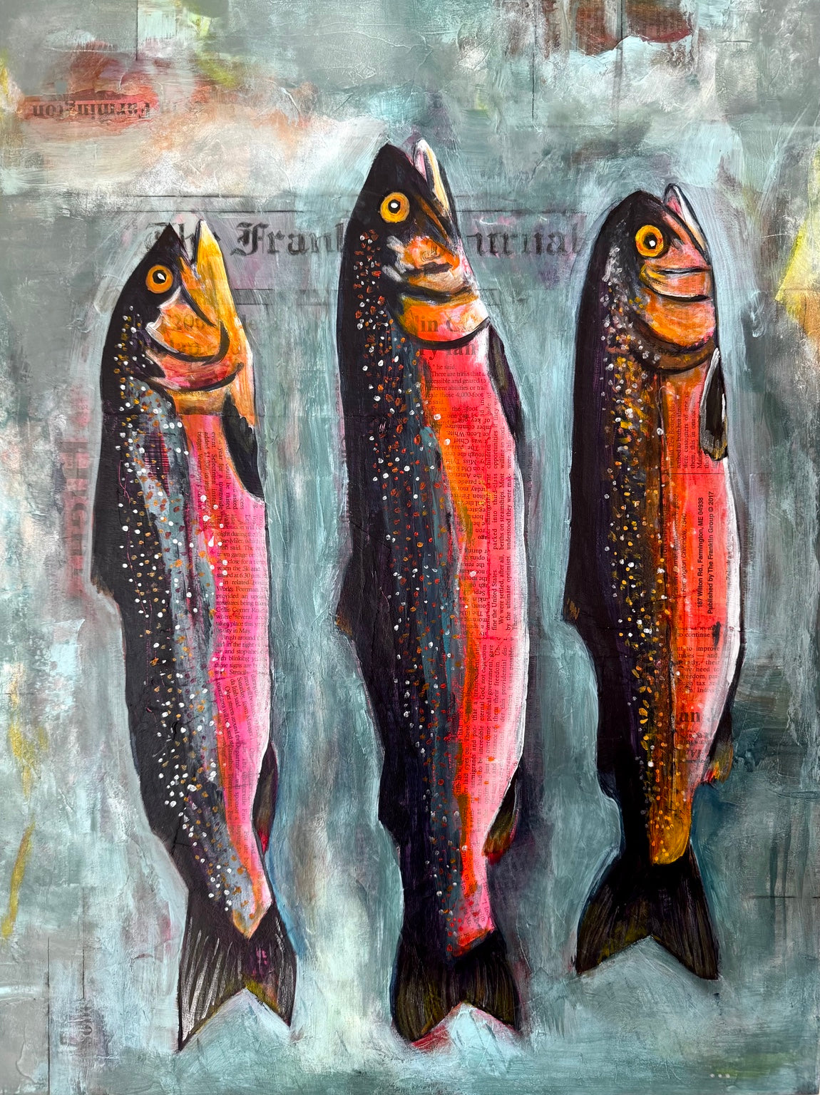 Detail view of Caught in Print showing three mixed media fish with Franklin Journal newspaper collage