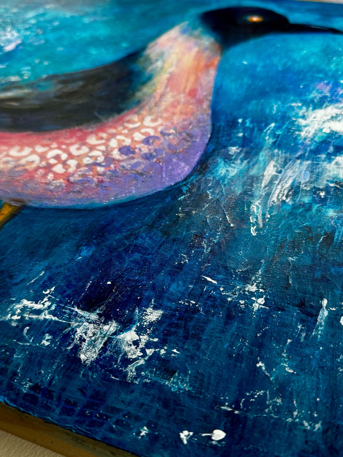 Angled detail of Town Birdie showing layered painted surface